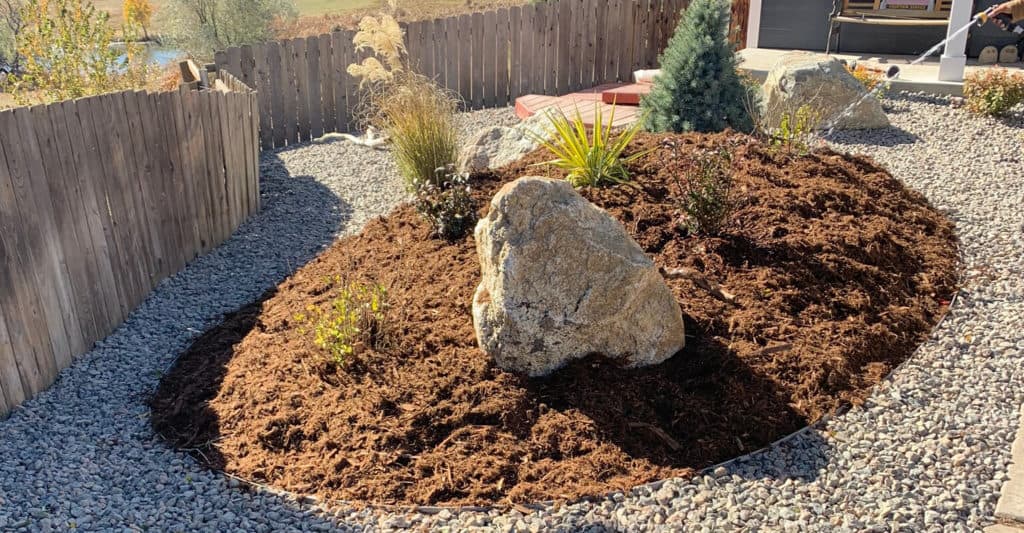 Berm with Mulch, Granite and Drought Resistant Plants in Xeriscape