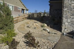 Side Yard Graded Slope with Rocks and Flagstone Walkway